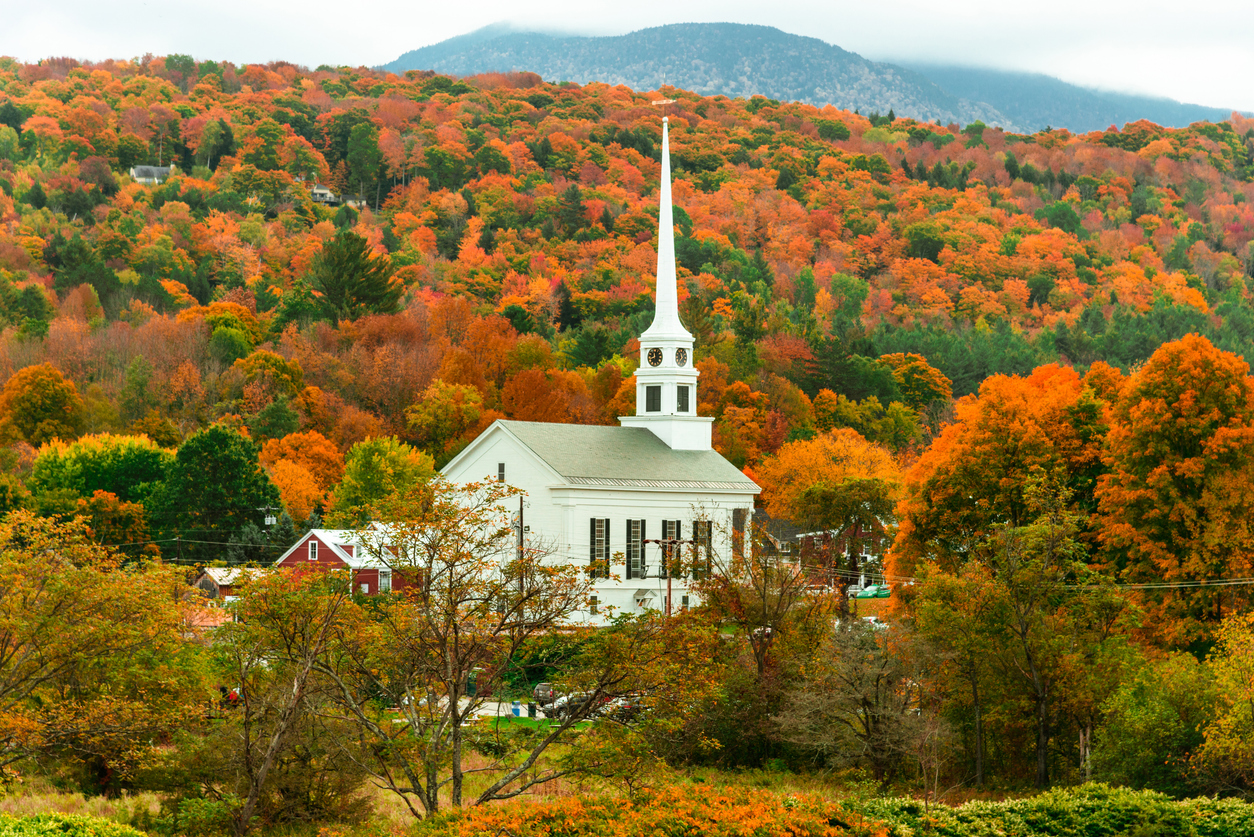 a white church in Vermont in autumn