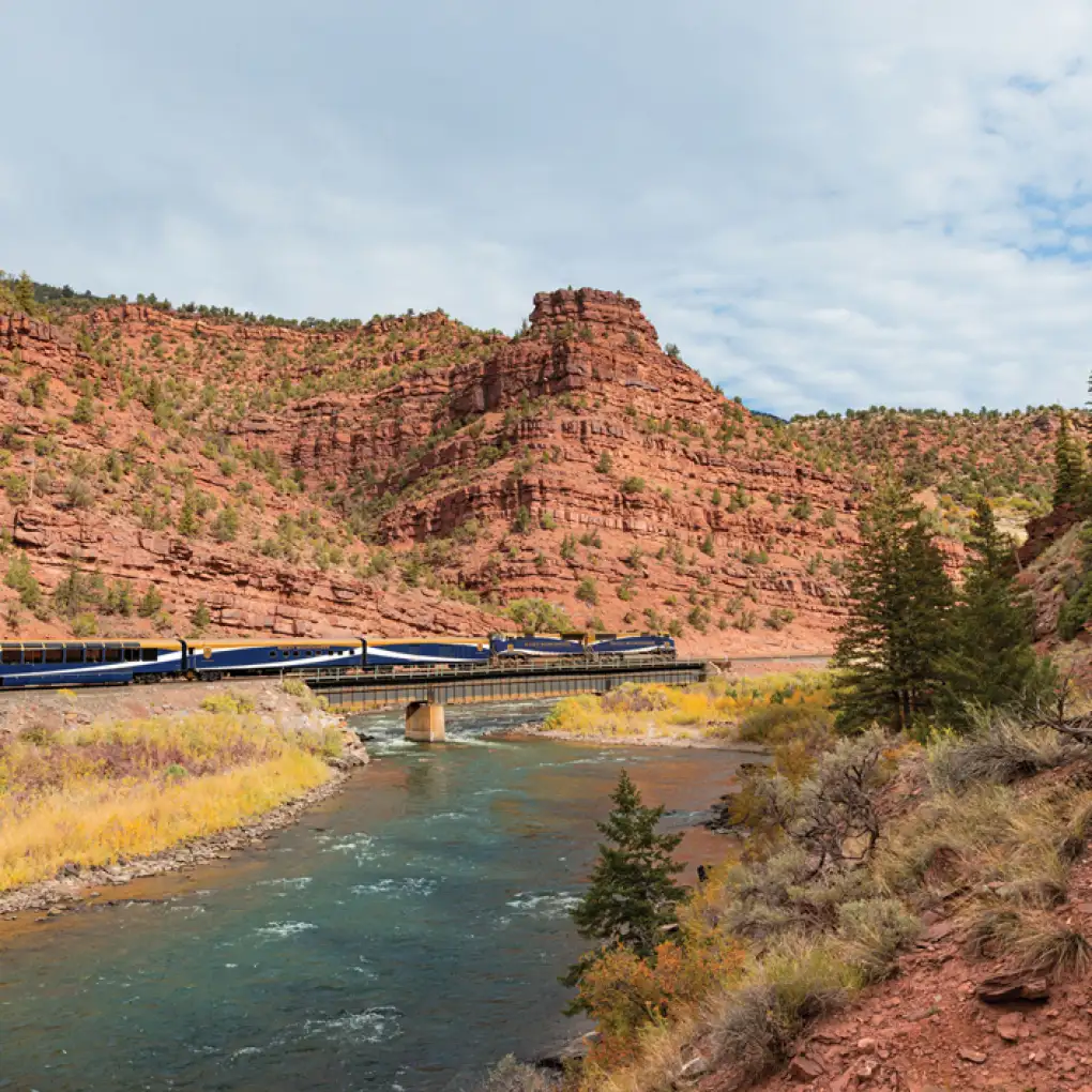 Canyon Spirit train travels through red rock valleys